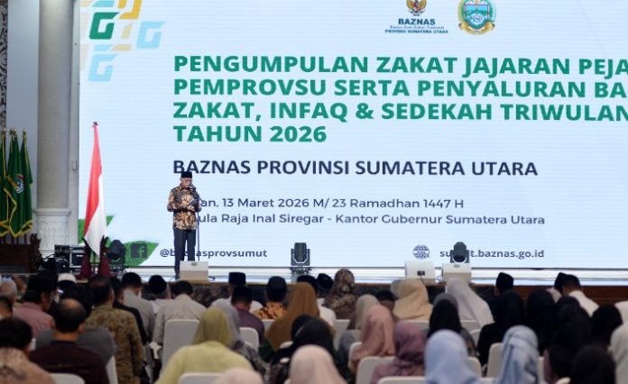 Teks Foto :  Wakil Gubernur Sumatera Utara (Sumut) Surya menghadiri pengumpulan zakat di lingkungan Pemerintah Provinsi Sumut, serta Penyaluran Zakat, Infaq dan Sedekah Triwulan I Tahun 2026 yang diselenggarakan oleh Badan Amil Zakat Nasional (Baznas) Provinsi Sumut di Aula Raja Inal Siregar Kantor Gubernur Sumut Jalan Diponegoro Kota Medan, Jumat (13/3/2026).(Foto : Ist)